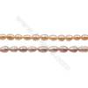 Perles culturelles perles d'eau douce pêche ou lavande sur fil  Taille 4~5mm  trou 0.7mm x1fil 15~16"